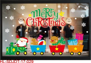 Close-up of Merry Christmas window stickers featuring Santa Claus on a colorful cartoon train