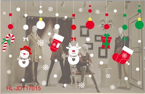Detail view of festive Christmas window stickers featuring snowman, snowflakes and gift boxes