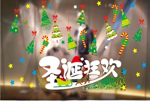 Detail view of Santa Claus sleigh and Christmas tree window stickers with stars
