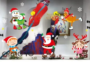 Detail view of festive window stickers with Santa, reindeer and snowman decorations