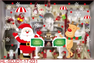 Detail showing Santa Claus and reindeer cartoon static window clings with Merry Christmas text