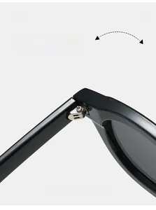 Macro view of durable metal hinge on black sunglasses frames with sturdy screw assembly