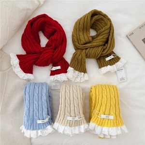 Slim knitted scarf with cable patterns and lace trim in various vibrant colors