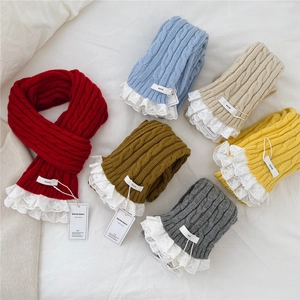 Long knitted narrow scarf with cable pattern and delicate lace trim in various colors