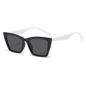 Chic cat eye sunglasses with black frame and white temples in 45 degree angle view