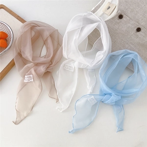 Three elegant lightweight solid color silk scarves in pink, white and blue with embroidery