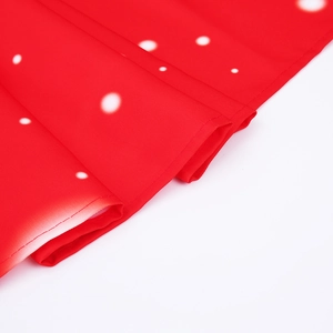 Detailed macro view of red fabric with white polka dots and precision stitched edges