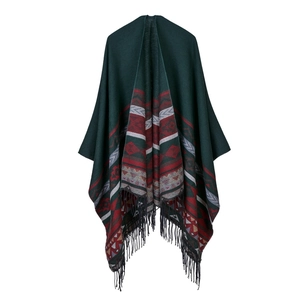 Women's reversible cashmere-feel poncho with green ethnic patterns and black tassels