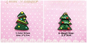 Détail de sapins de Noël en résine pailletée avec rayures colorées et cœurs rouges