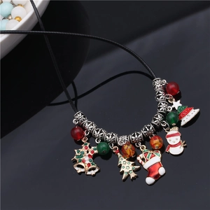 Christmas necklace with woven cord featuring enamel bells, tree, snowman and stockings
