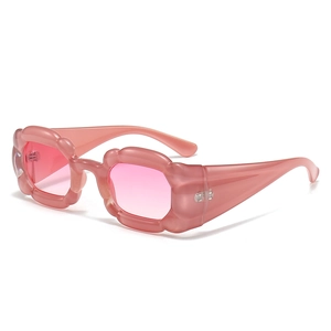 Pink Y2K pumpkin wavy sunglasses with gradient lenses on a minimalist white background