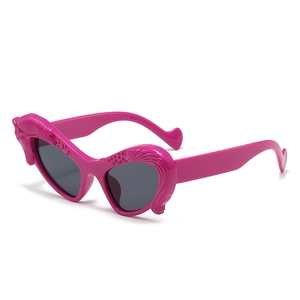 Unique winged pegasus style rose pink sunglasses with heart tips and dark grey lenses