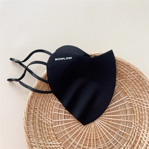 Detail of black breathable sun protection mask with adjustable ear loops and logo