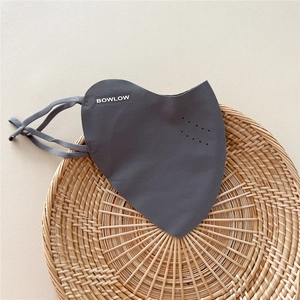 Detailed view of dark grey breathable sun protection mask with laser-cut air holes and adjustable straps