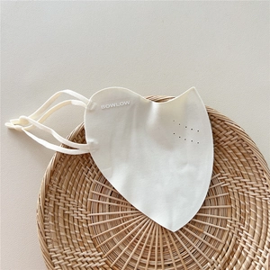 Detailed view of beige breathable sun mask with laser-cut ventilation holes