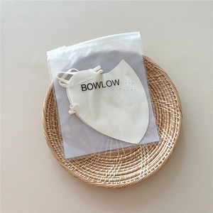 Close-up of a breathable sun protection face mask in beige fabric with ear loops