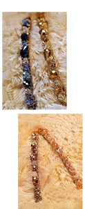 Detail of handmade crystal headbands with faceted beads in blue, yellow, and coffee