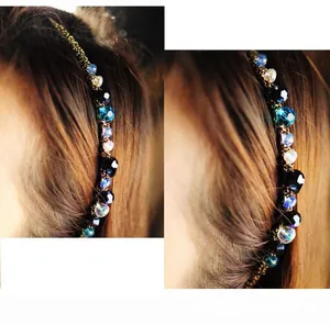 Detail of slim metal headband with colorful multifaceted crystal beads on dark hair