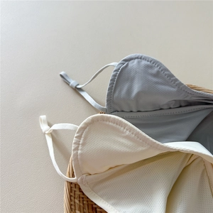 Detail of mesh lining and adjustable straps on breathable sun protection masks