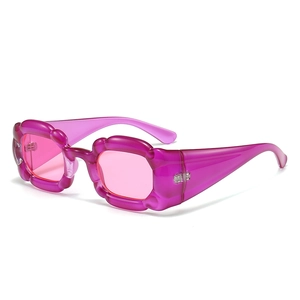 Stylish purple Y2K sunglasses with translucent wave frame and tinted lenses for women