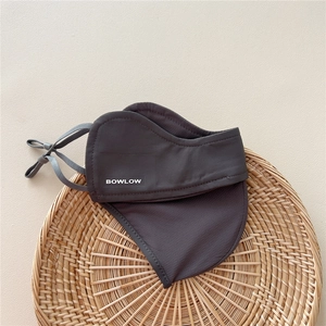Detailed view of the dark grey breathable sun protection mask with adjustable ear straps