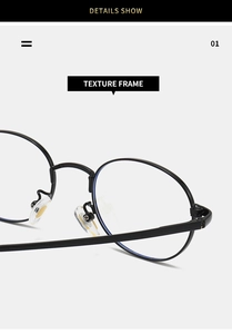 Detail showing the adjustable nose pads and metal hinge of these oval black frame glasses