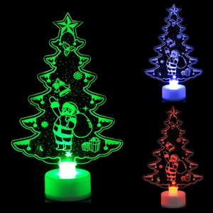 3D LED Christmas tree night light with colorful acrylic patterns on a black base