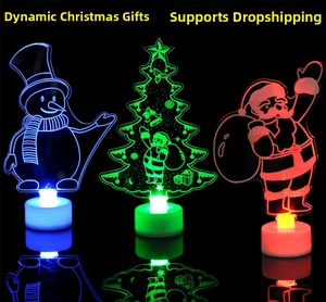 Detailed view of LED acrylic Christmas tree and snowman glowing in colorful lights