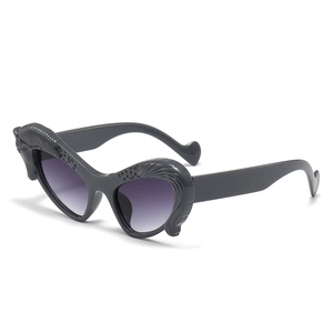 Chic cat-eye sunglasses with unique Pegasus wing relief and purple gradient lenses