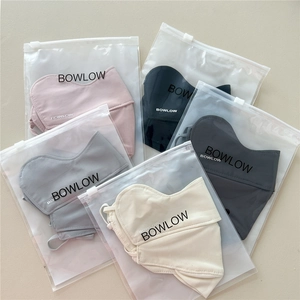 Detailed view of breathable sun protection masks in individual branded slider pouches