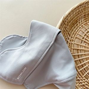 Detail view of breathable mesh fabric and cool-touch material on light gray sun mask
