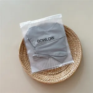 Grey breathable sun protection mask with adjustable ear loops in matte ziplock packaging