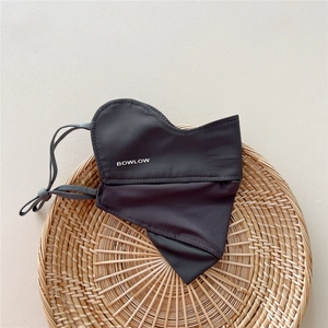 Detail of dark grey sun mask with breathable mesh fabric and adjustable ear loops