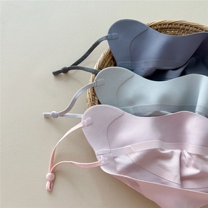 Detailed view of breathable ice silk sun masks in soft blue, green, and pink colors