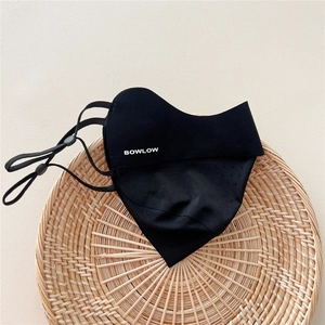 Detail of black breathable sun protection mask with BOWLOW logo and adjustable ear loops