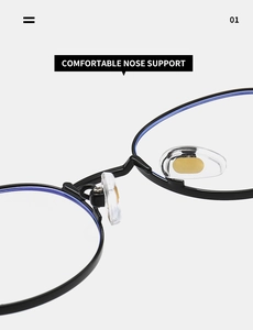 Macro detail of comfortable silicone nose pads on oval black metal frame glasses