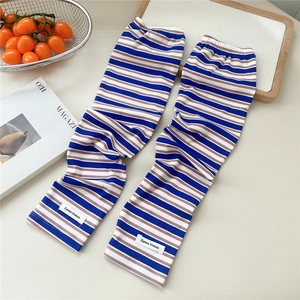 Detail of striped UV protection cooling arm sleeves with knitted texture and brand label