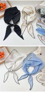 Close-up of lightweight striped and polka dot neck scarves with elegant wavy hem edges