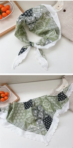 Detail of vintage green floral cotton neckerchief with white crochet lace trim