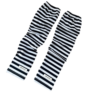 Two-tone striped sun protection arm sleeves in black and white knit with brand tag