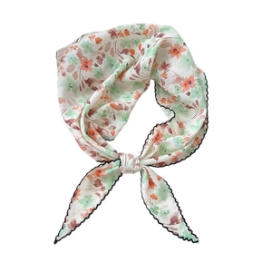 Floral print lightweight neck scarf with orange and green patterns and black wave edges