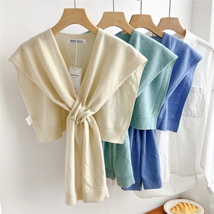 Solid knit wool shawl wrap with tie-front knot design in cream, green and blue colors