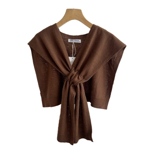 Solid color dark brown knitted wool shawl with knot design and brand labels