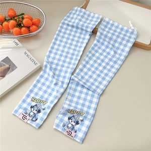 Detail of blue and white plaid sun sleeves featuring cute dog print and adjustable drawstring