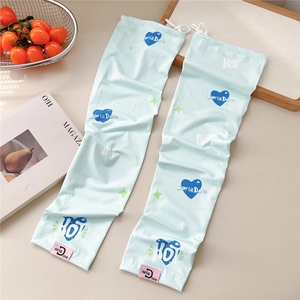 Detail of light blue cooling sleeves with navy heart patterns and pink woven label