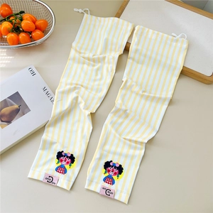 Detail of yellow striped sun protection sleeves featuring a cute cartoon print and drawstring