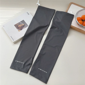 Detail of dark grey sun protection sleeves with adjustable drawstring and logo