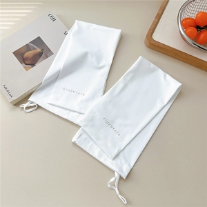 Detail of white sun protection arm sleeves with adjustable drawstring and logo