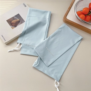 Close-up of light blue ice silk arm sleeves featuring an adjustable drawstring and brand logo