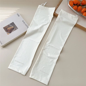 Close-up of white sun protection arm sleeves with drawstring cuffs and logo detail